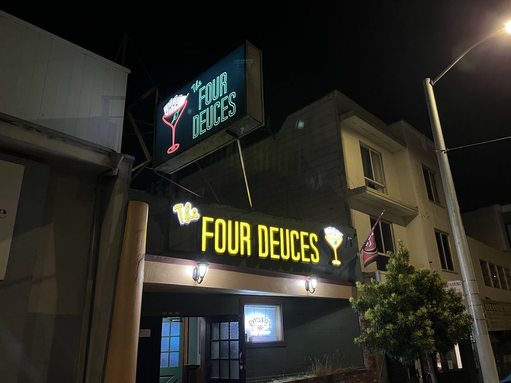 The Four Deuces neon sign at night